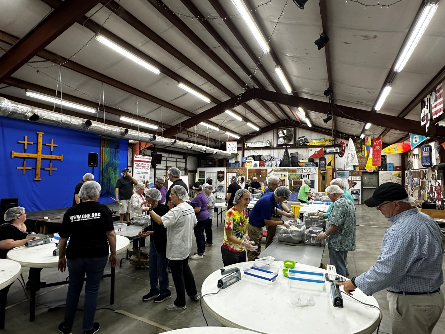 Volunteers receiving instructions at Rise Against Hunger Event - Sound District