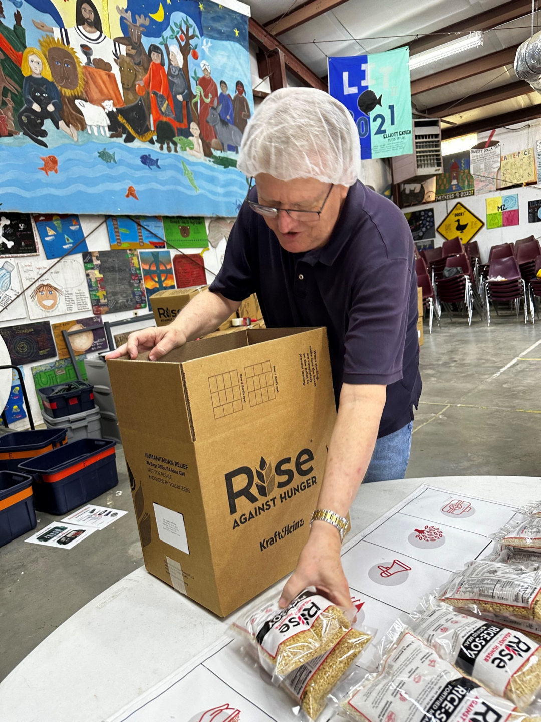 Volunteer packing the completed meal bags at Rise Against Hunger Event - Sound District